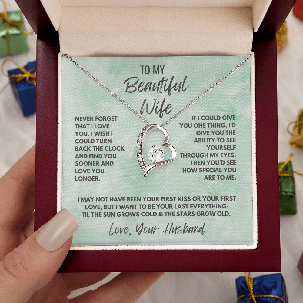 Forever Love Necklace, available in white or yellow gold.