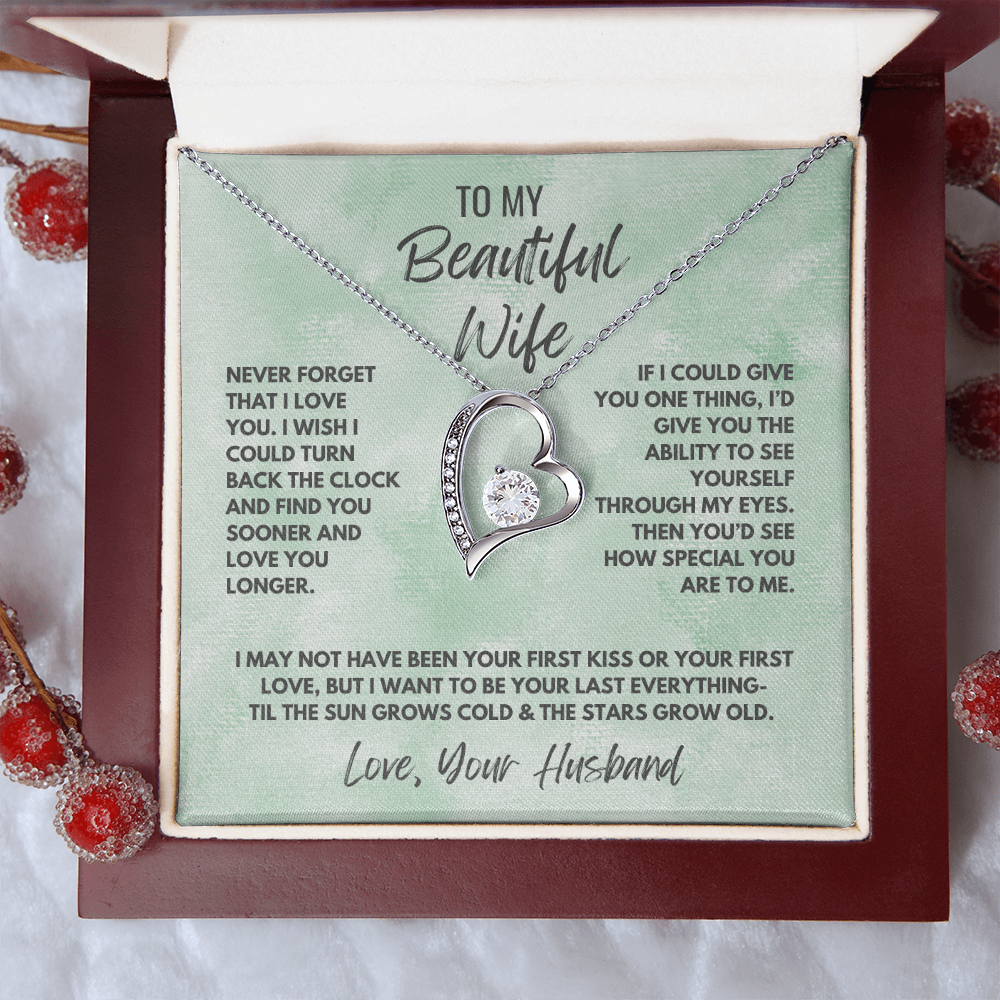 Forever Love Necklace, available in white or yellow gold.
