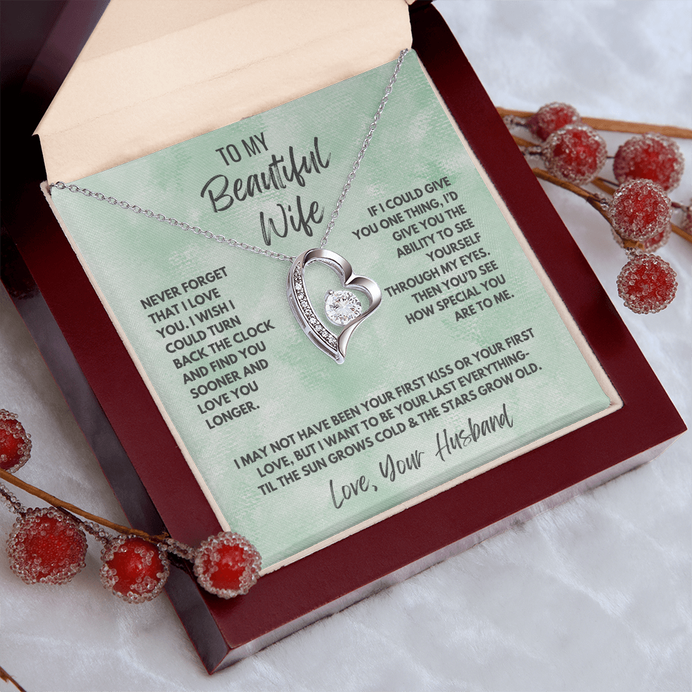 Forever Love Necklace, available in white or yellow gold.