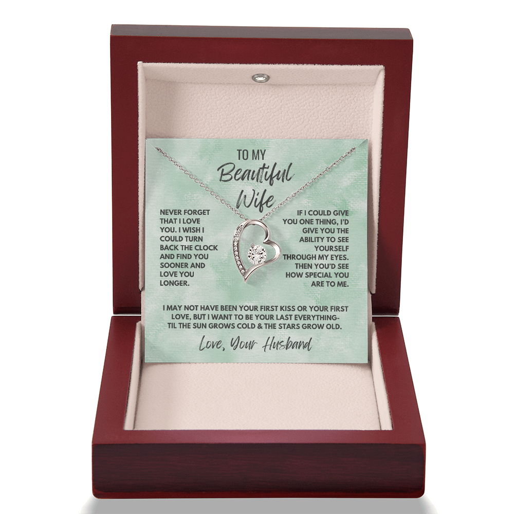 Forever Love Necklace, available in white or yellow gold.