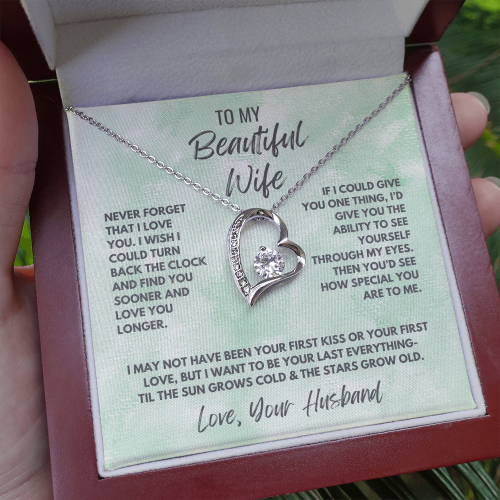 Forever Love Necklace, available in white or yellow gold.