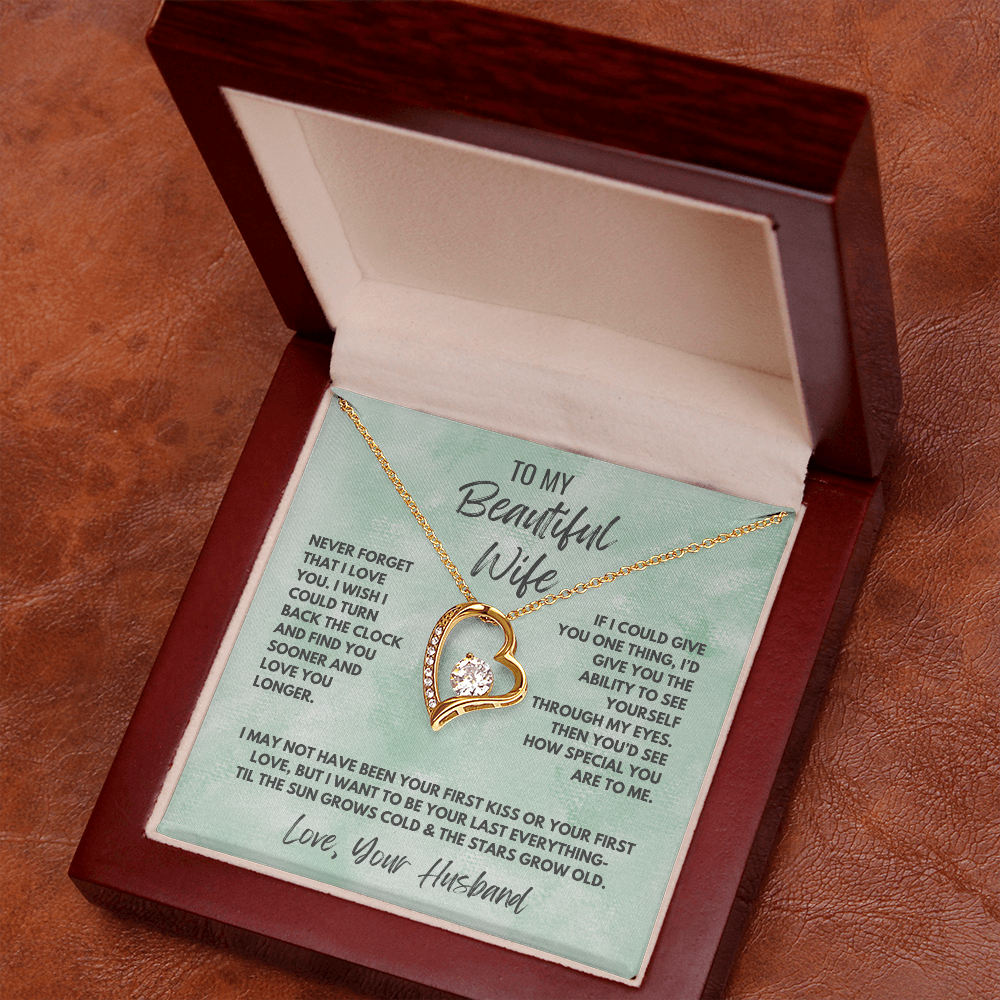 Forever Love Necklace, available in white or yellow gold.