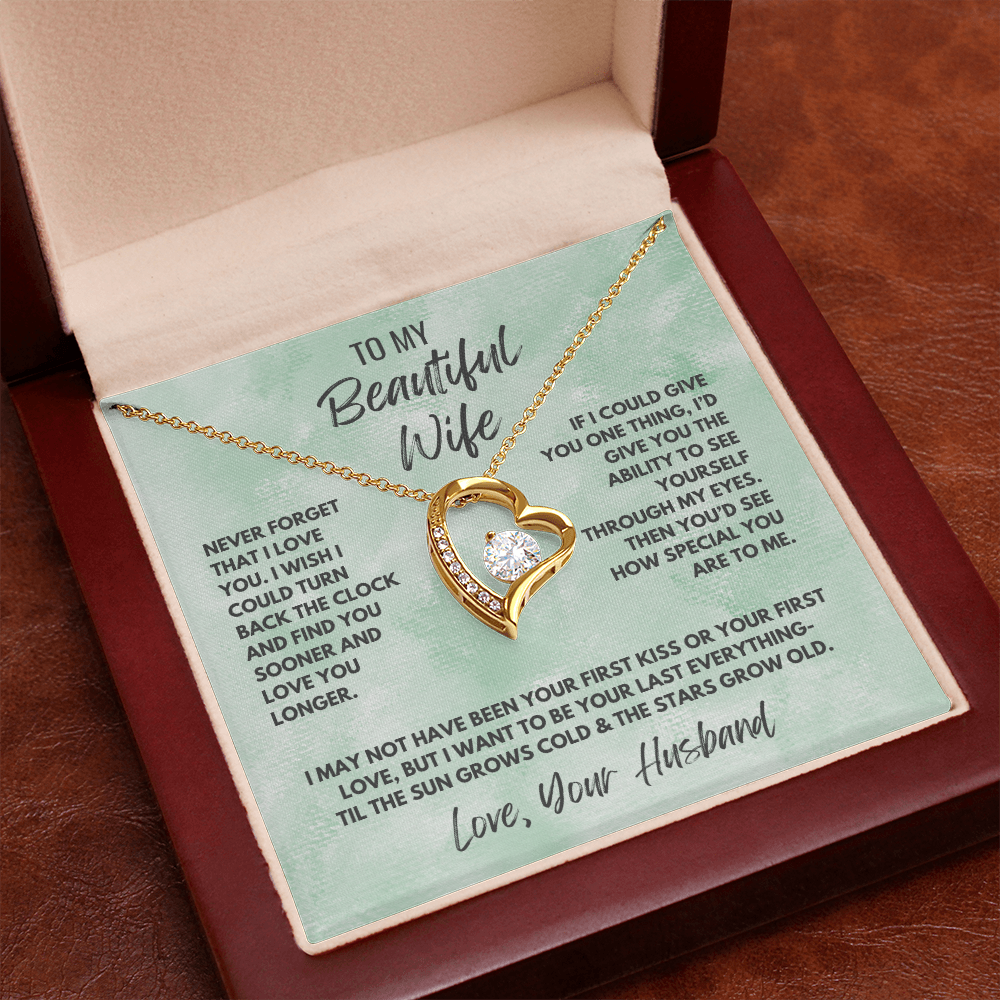 Forever Love Necklace, available in white or yellow gold.
