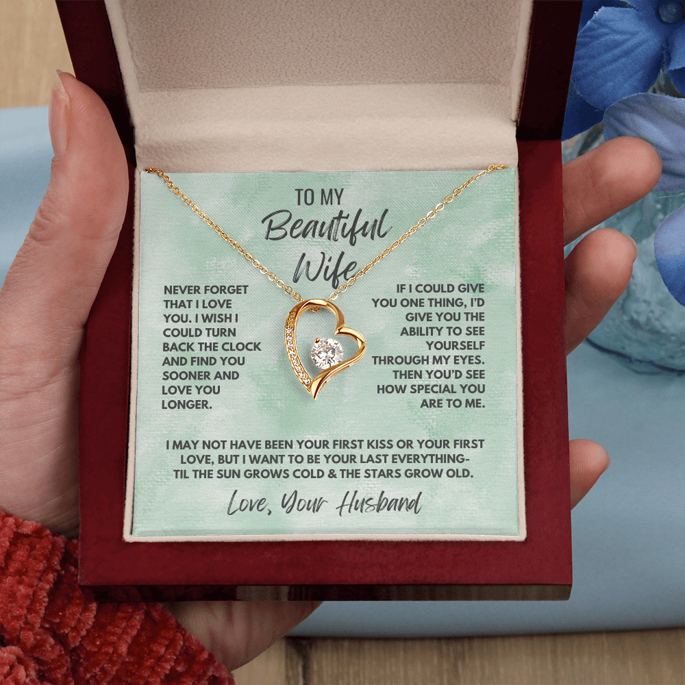 Forever Love Necklace, available in white or yellow gold.