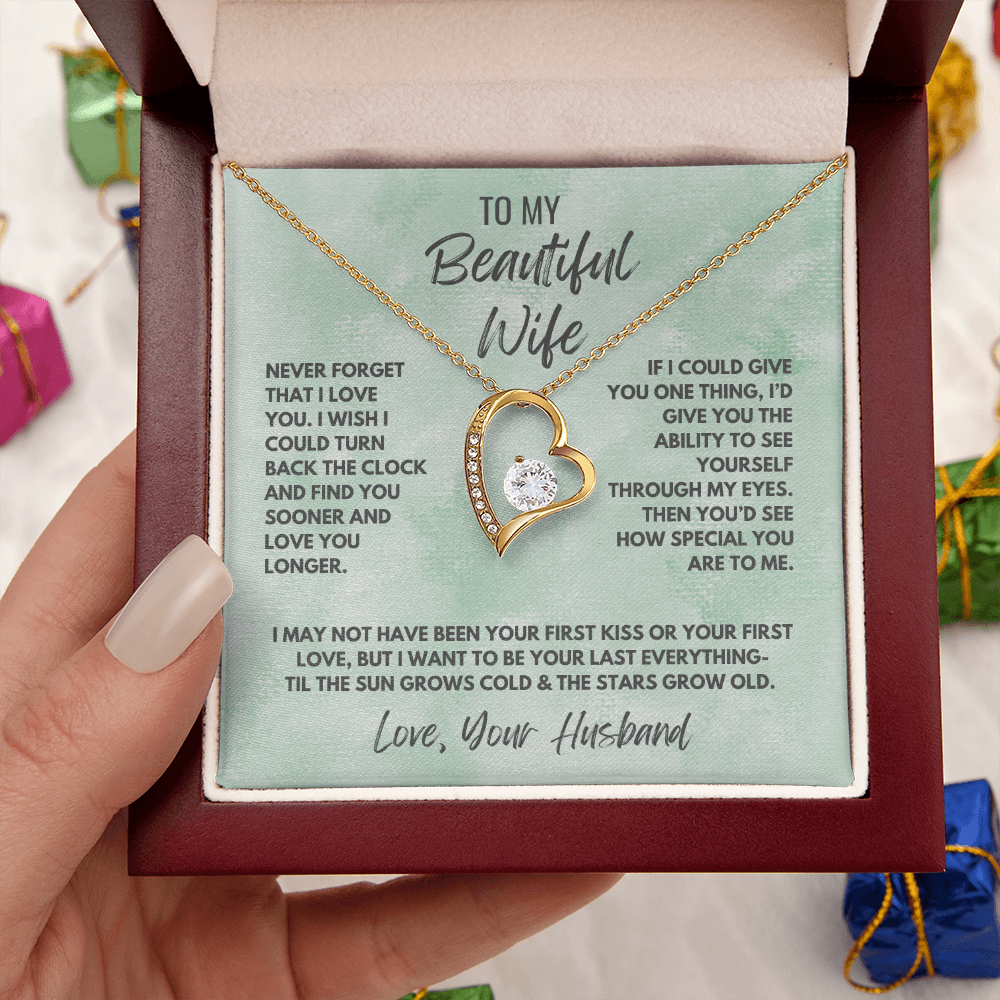 Forever Love Necklace, available in white or yellow gold.