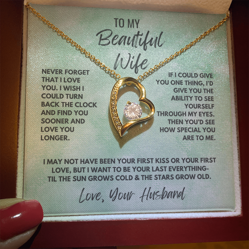 Forever Love Necklace, available in white or yellow gold.
