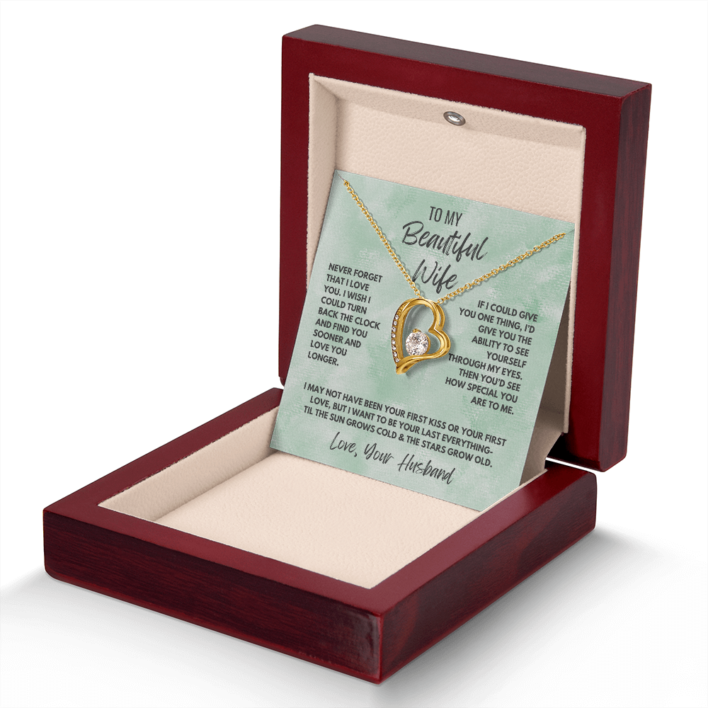 Forever Love Necklace, available in white or yellow gold.