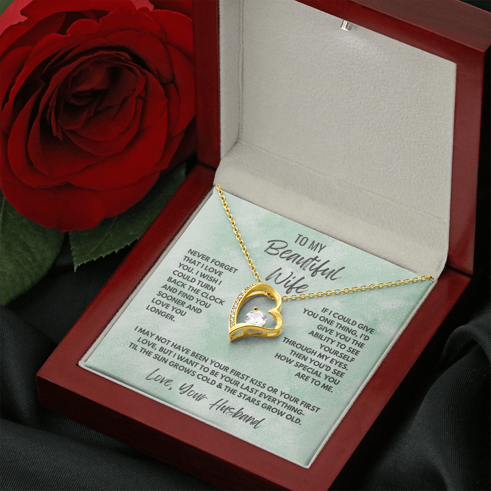Forever Love Necklace, available in white or yellow gold.