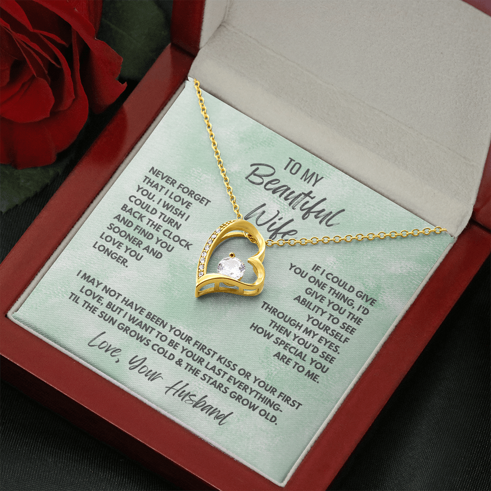 Forever Love Necklace, available in white or yellow gold.