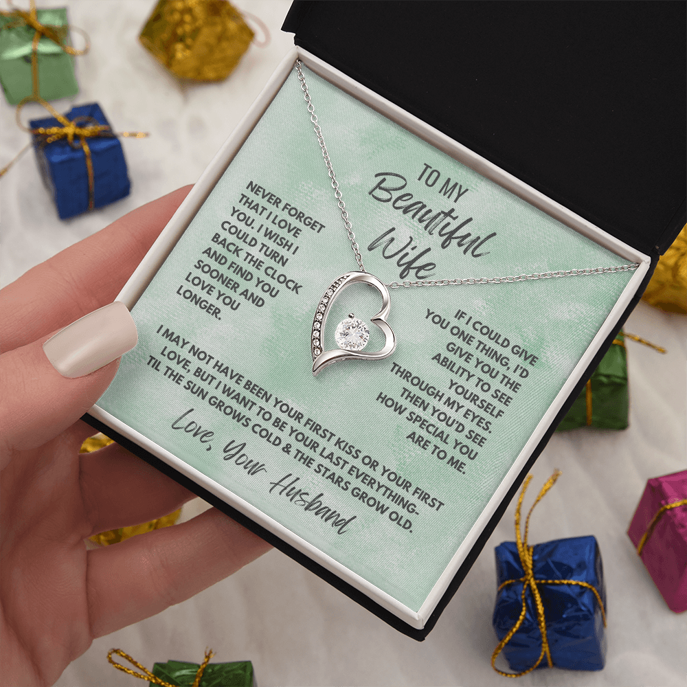 Forever Love Necklace, available in white or yellow gold.