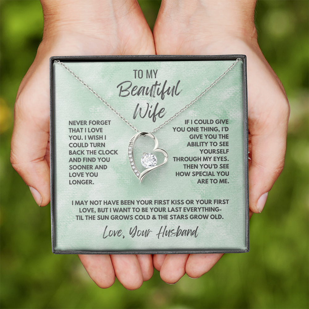 Forever Love Necklace, available in white or yellow gold.