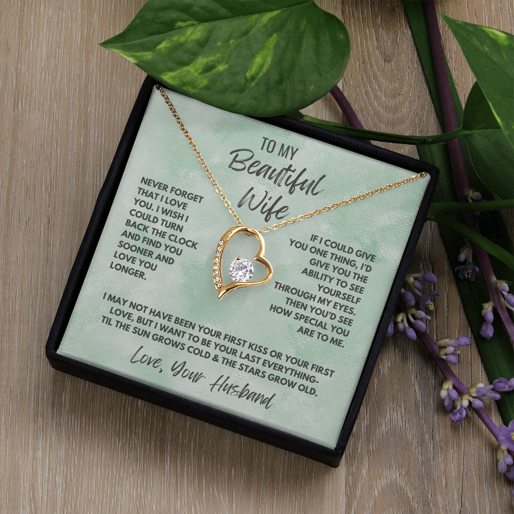 Forever Love Necklace, available in white or yellow gold.
