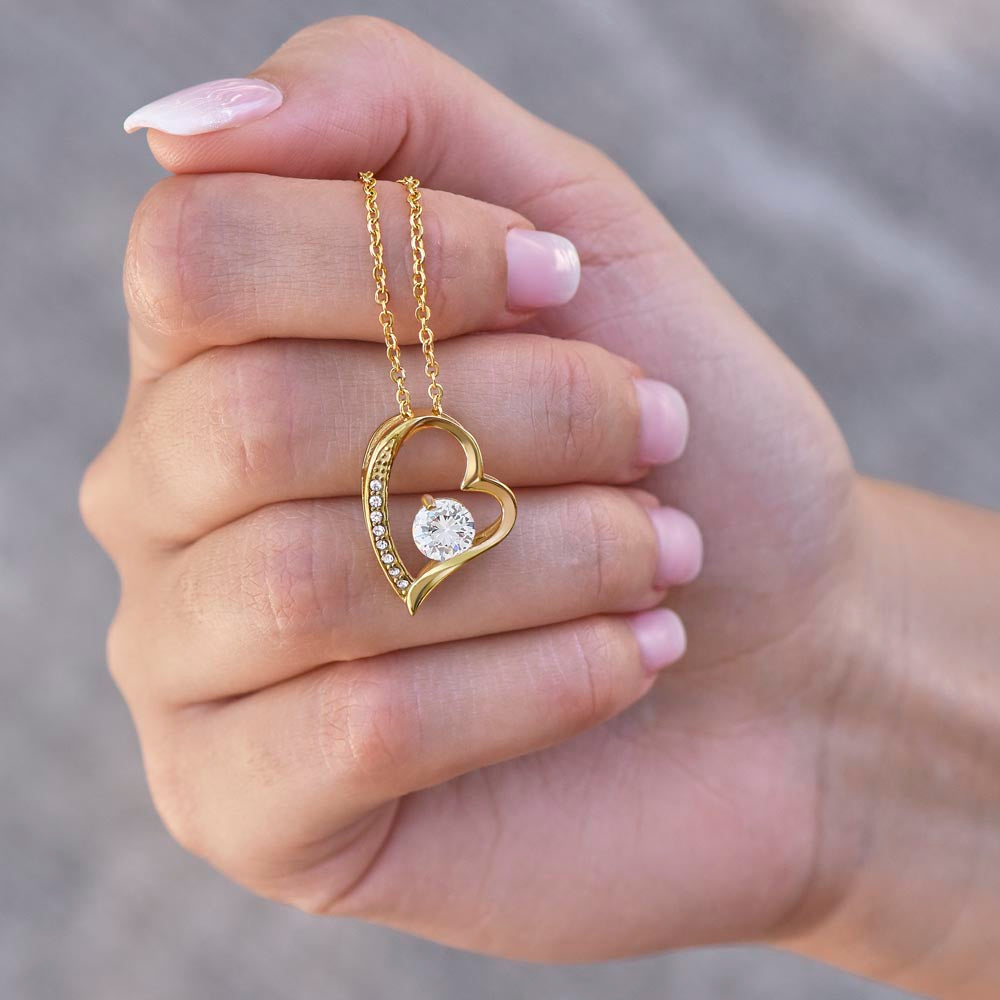Forever Love Necklace, available in white or yellow gold.