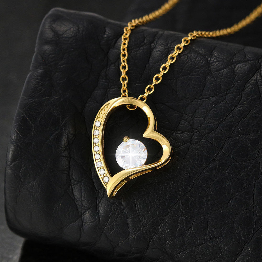 Forever Love Necklace, available in white or yellow gold.