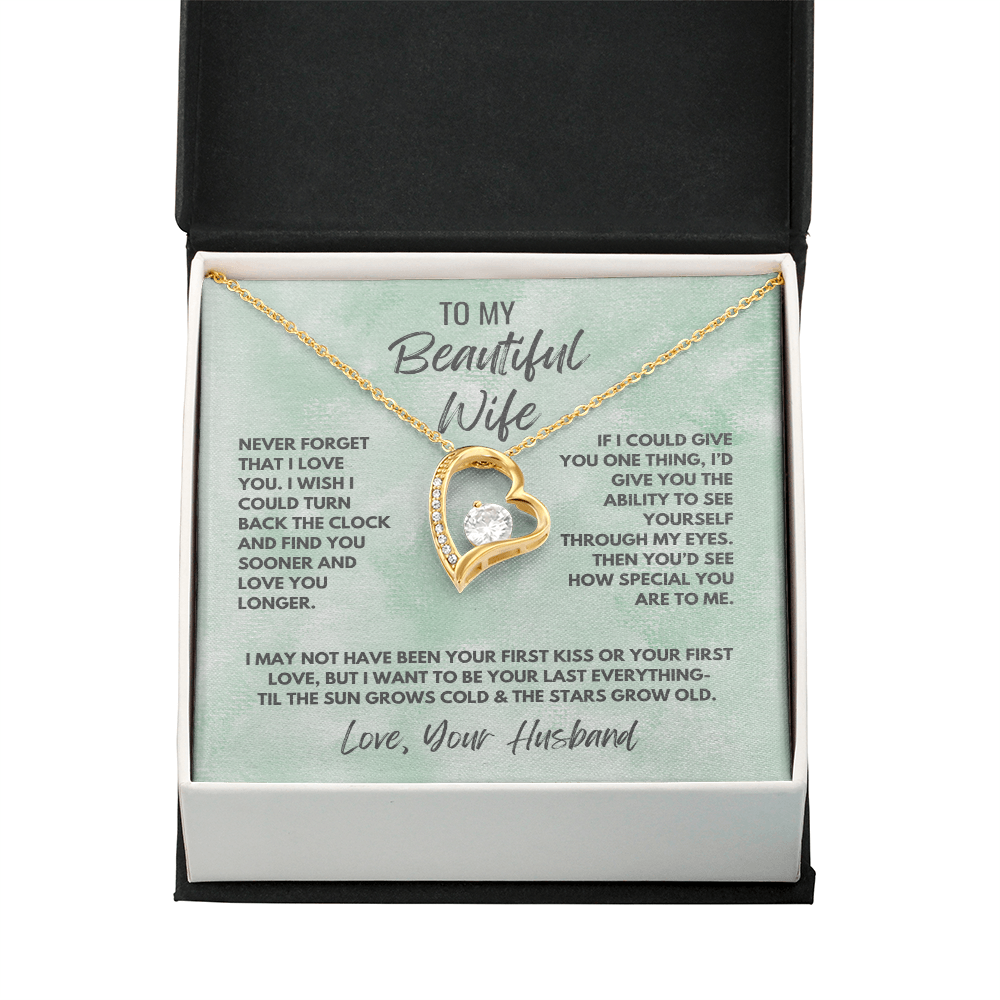 Forever Love Necklace, available in white or yellow gold.