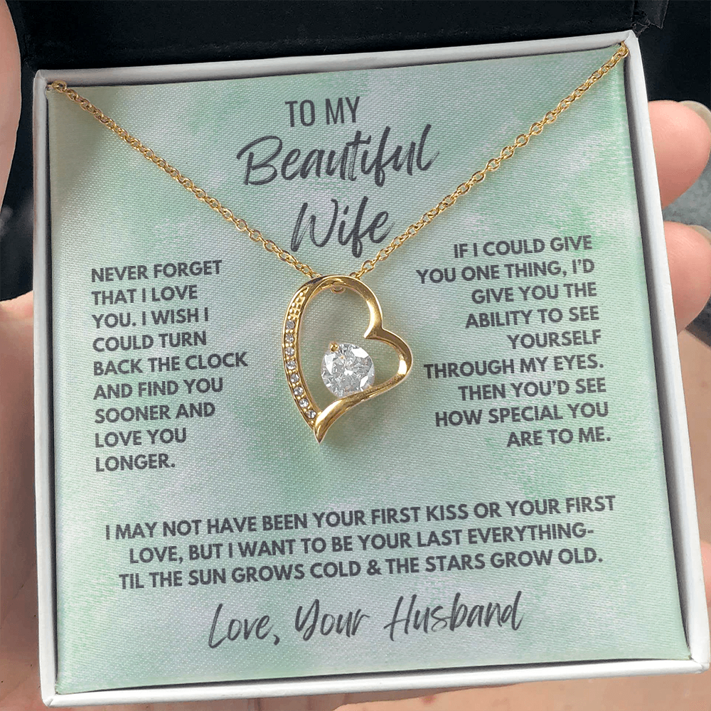 Forever Love Necklace, available in white or yellow gold.