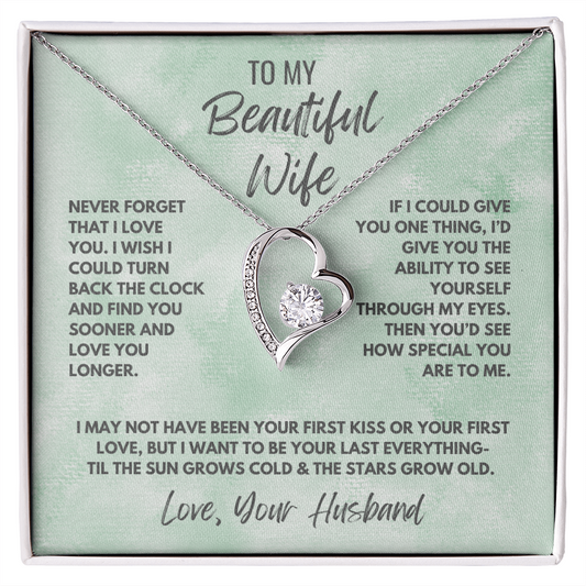 Forever Love Necklace, available in white or yellow gold.